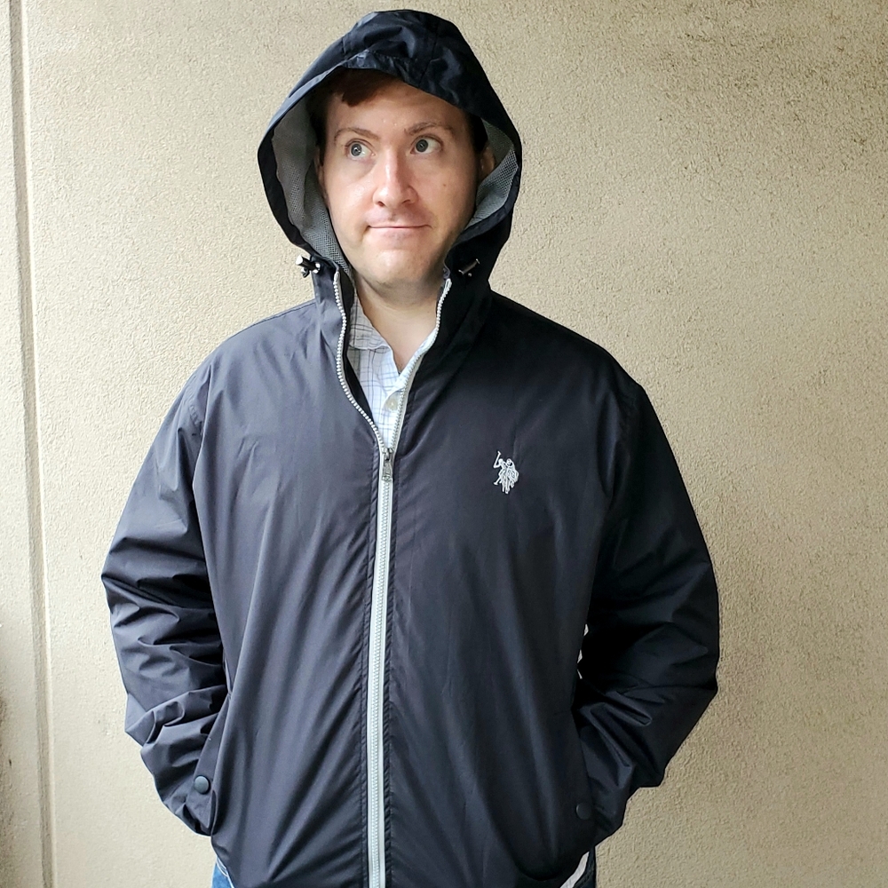 US Polo Assn. Hooded black Windbreaker jacket.